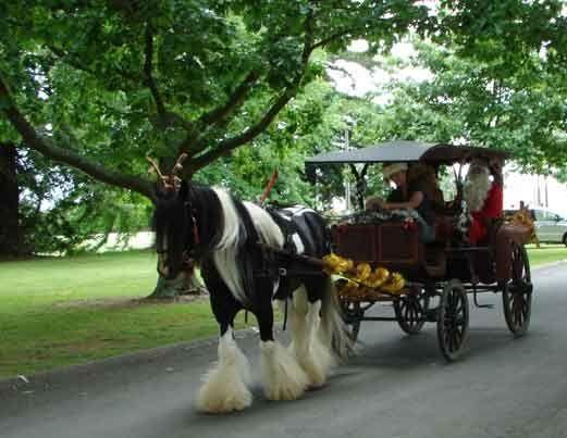 Taking Santa and his fairies to Henley's school children. Copyright BGV